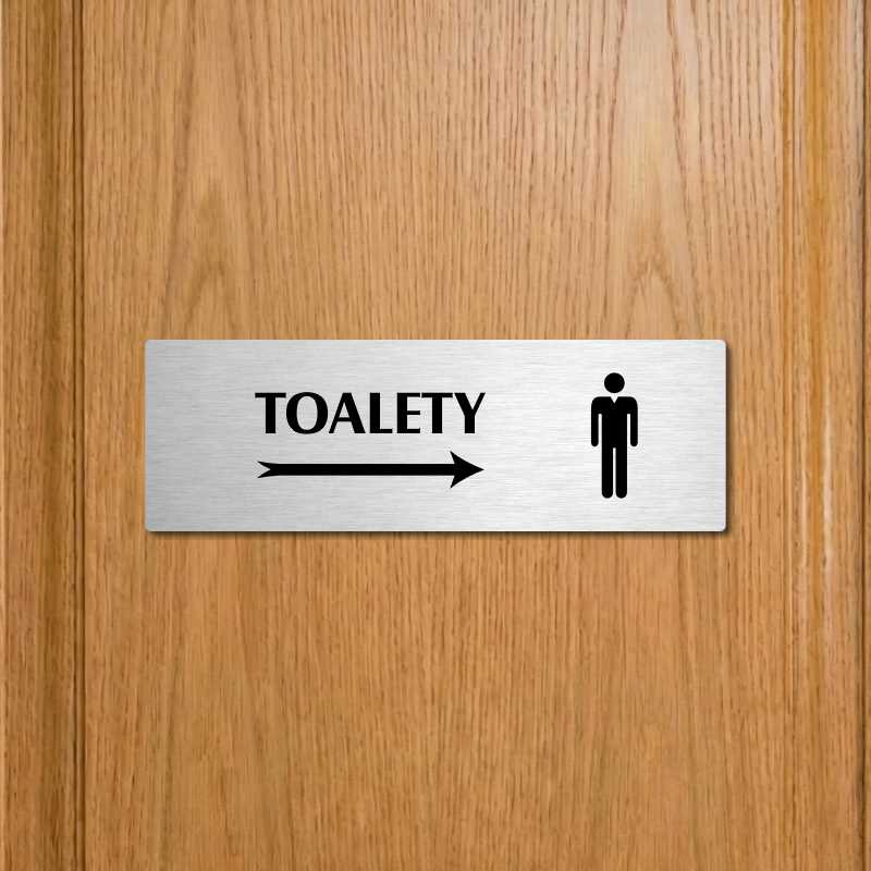 Toalety vpravo muži, 240x79mm, zlatá popiska s ozdobou uprostřed